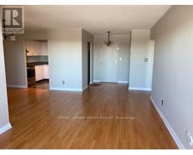 A room with wooden floors and white walls.