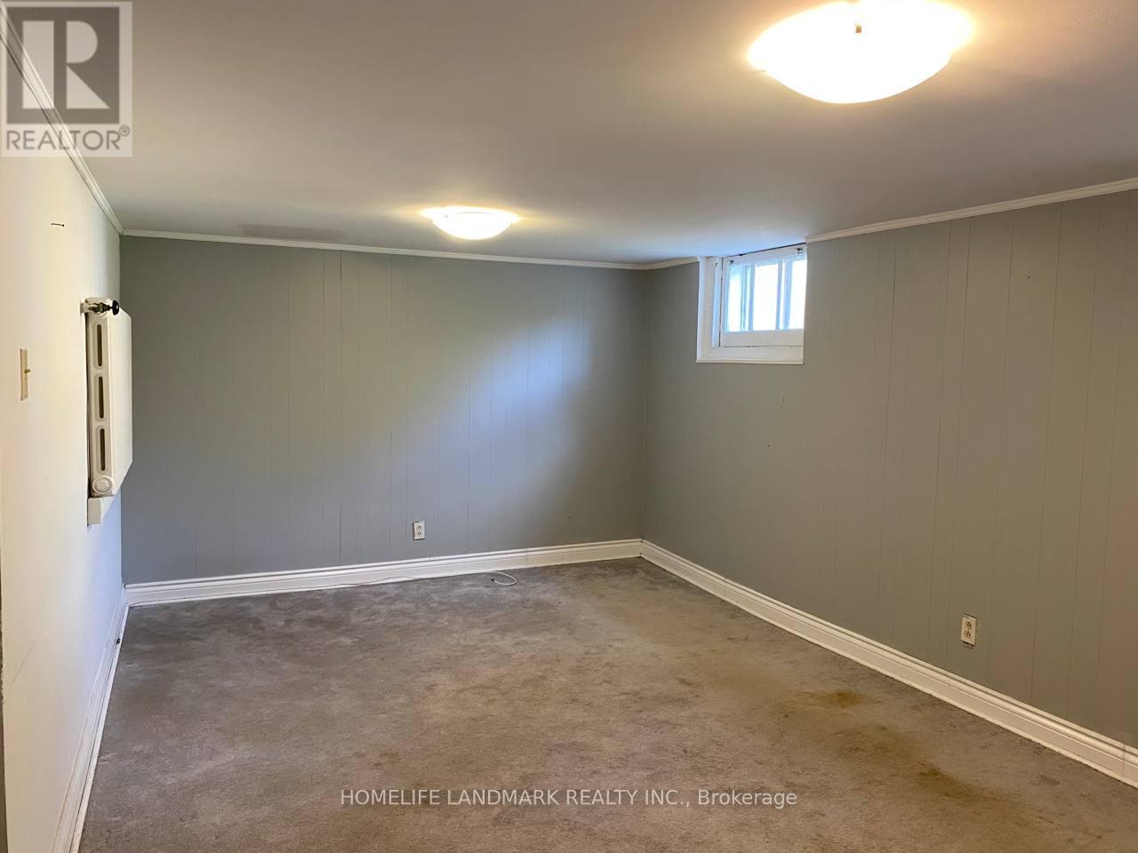 A room with a window and a door, presented by HomeLife Landmark Realty Inc. Brokerage.