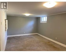 A room with a window and a door, presented by HomeLife Landmark Realty Inc. Brokerage.