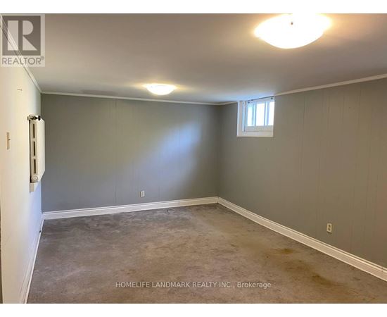 A room with a window and a door, presented by HomeLife Landmark Realty Inc. Brokerage.