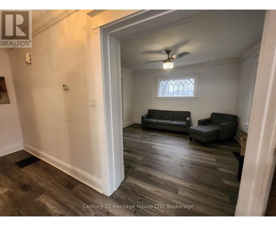A living room with a couch and a chair.