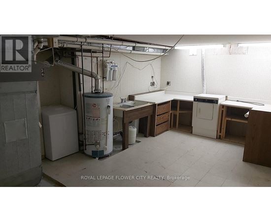 A room with a lot of white space and a sign that says REALTOR.