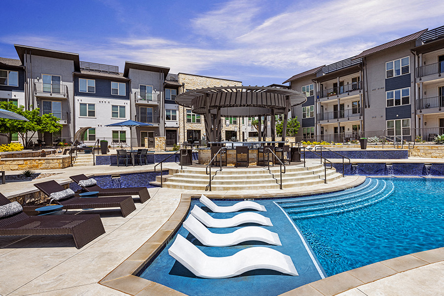 the Domain apartments - The Addison Apartments Poolside lounge with ample seating