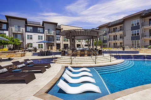 the Domain apartments - The Addison Apartments Poolside lounge with ample seating
