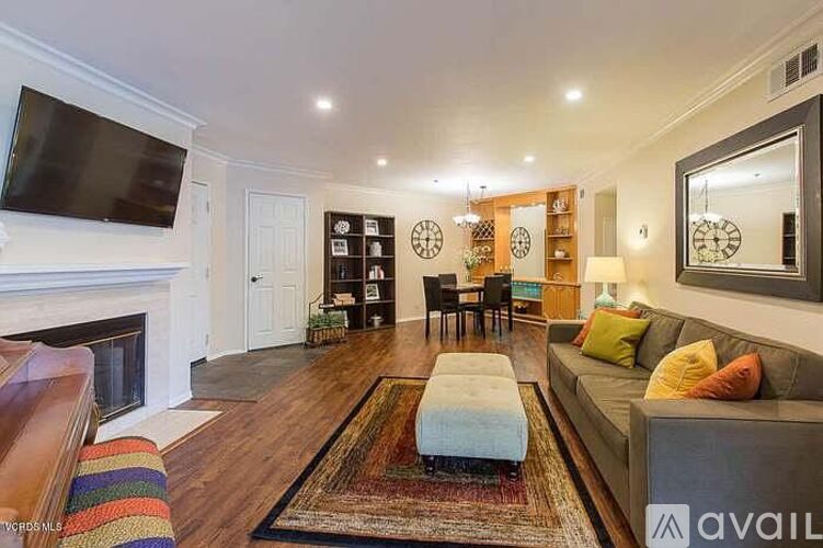 A living room with a fireplace and a couch.