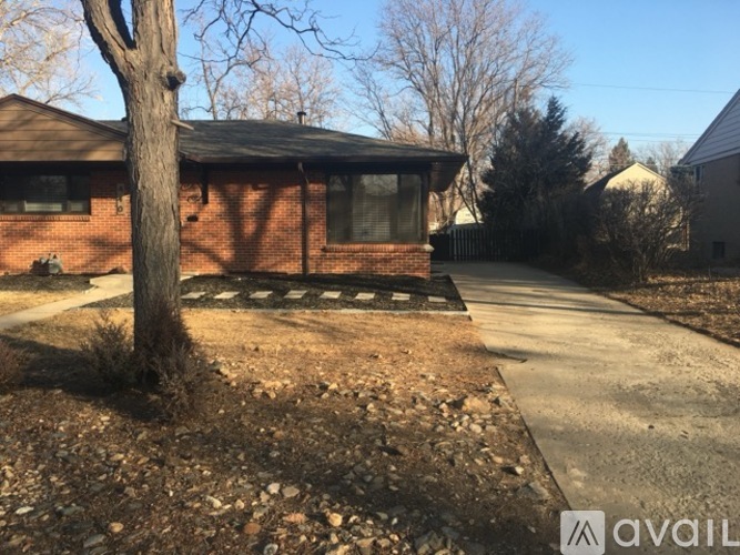 A house with a tree in front of it.