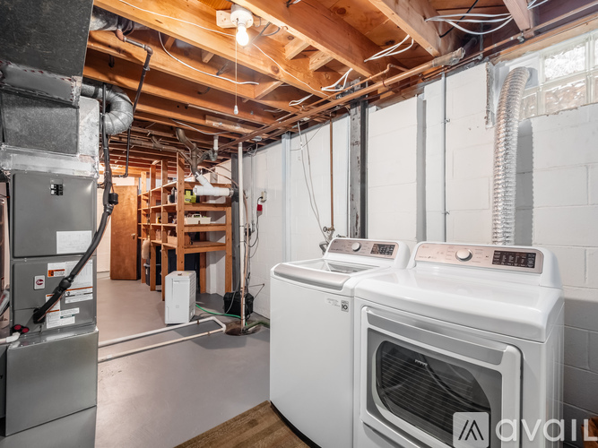 A modern kitchen with a white oven and a stainless steel refrigerator.