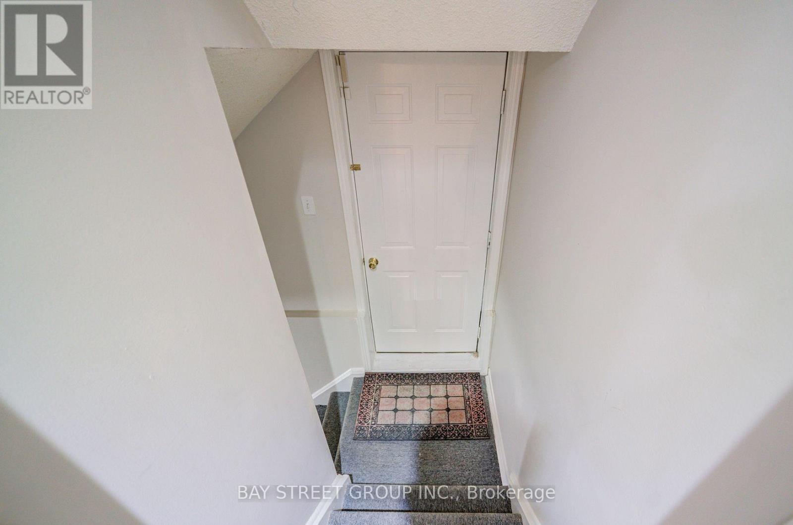A white door with a small window above it.