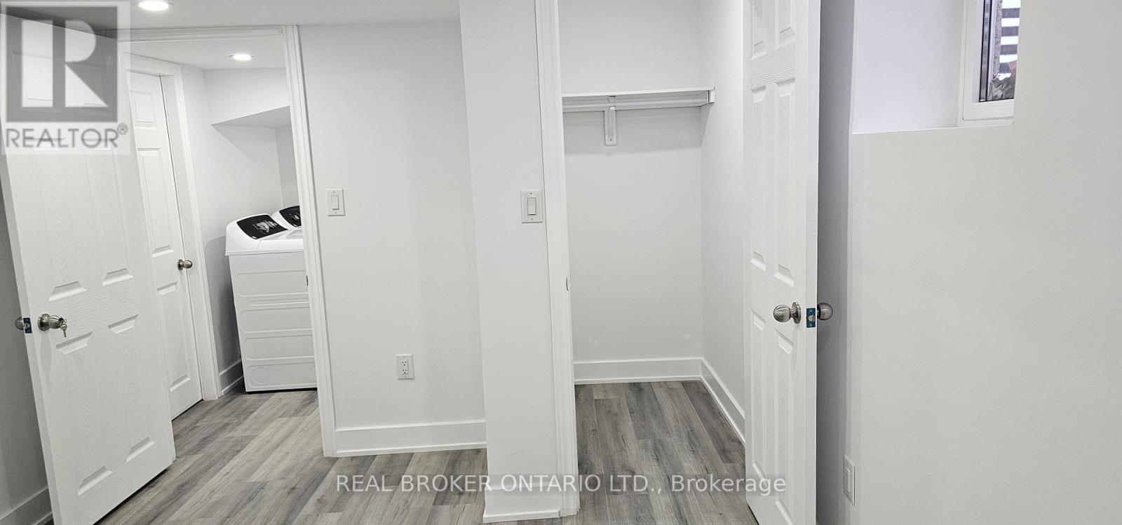 A bedroom with a bed, dresser, and closet.