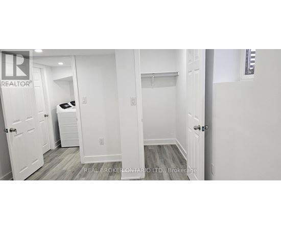 A bedroom with a bed, dresser, and closet.