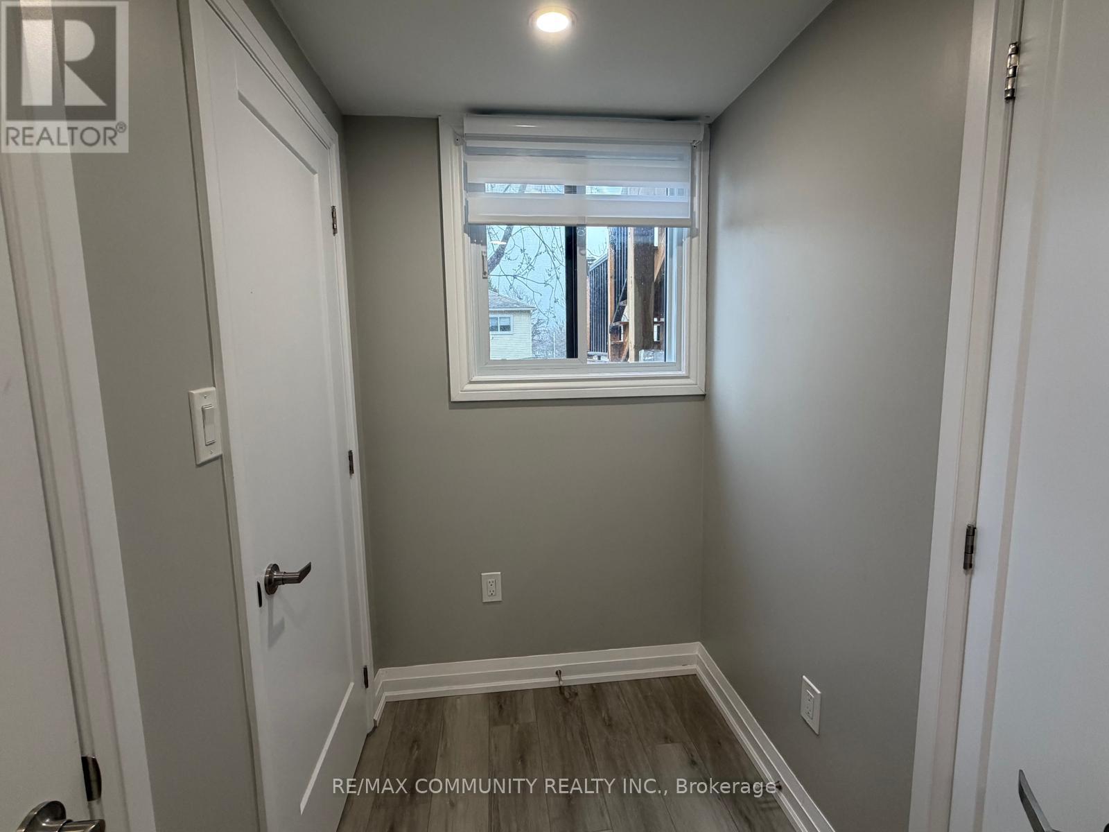A small room with a window and a door.