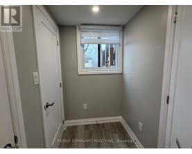 A small room with a window and a door.