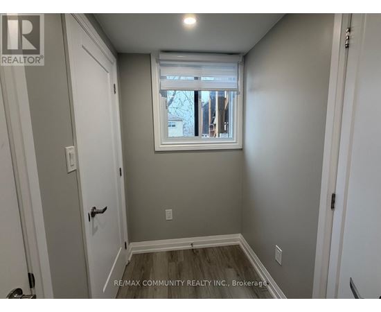 A small room with a window and a door.
