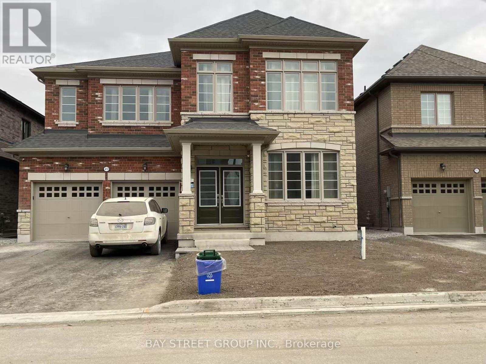 A two-story house with a garage is for sale by Bay Street Group Inc.