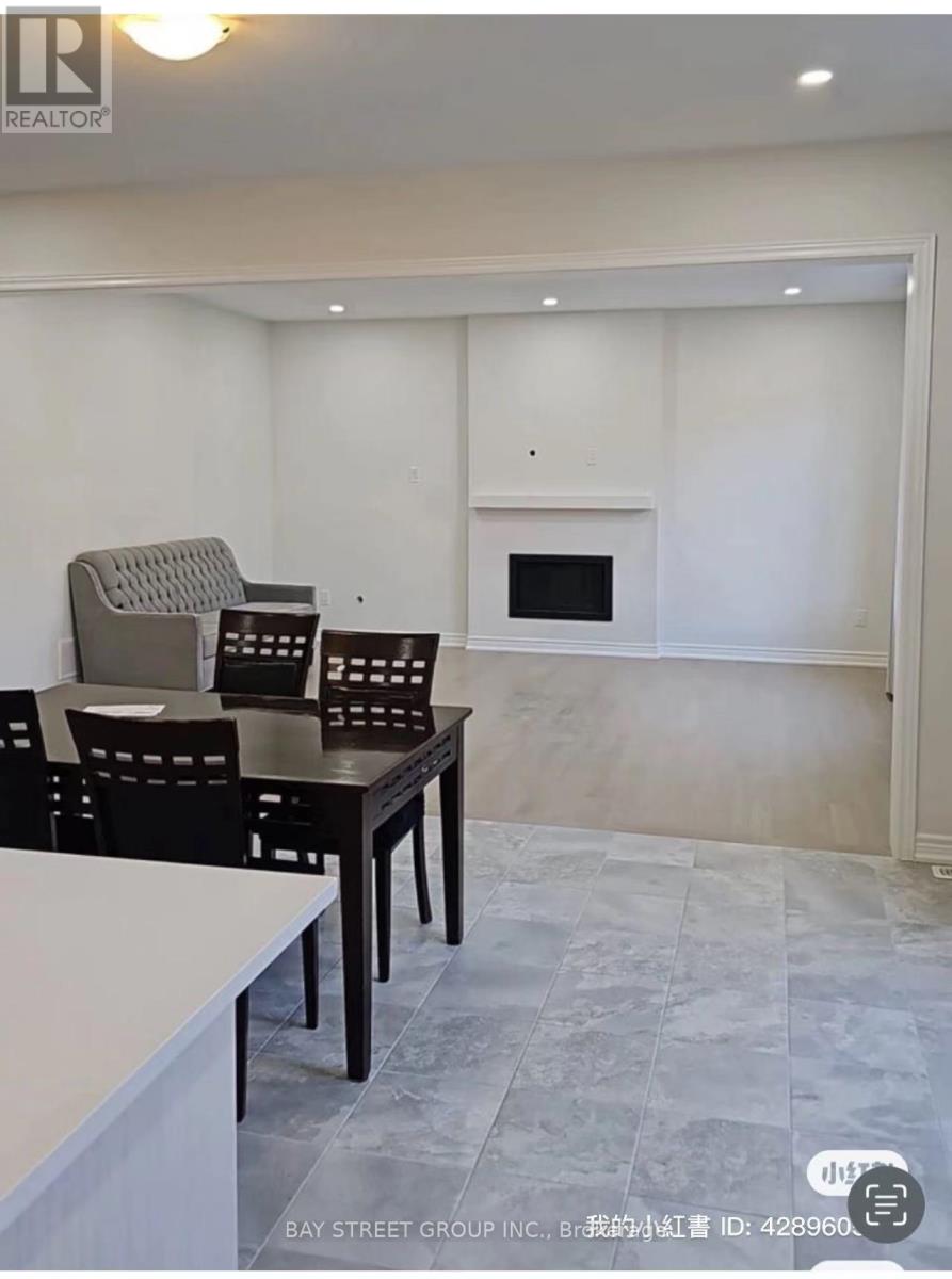 A Bay Street Group Inc. logo is displayed on a wall in a modern kitchen.