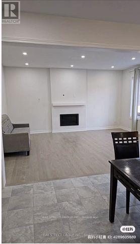 A living room with a fireplace and a couch.
