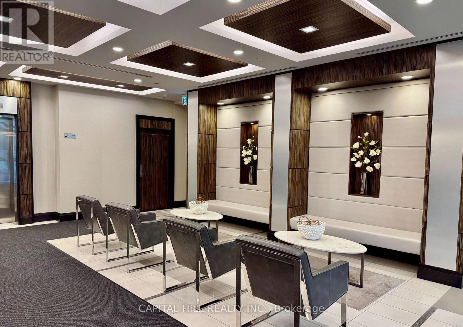 A conference room with a long table and chairs.