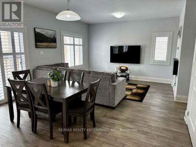 A dining room with a table set for four.