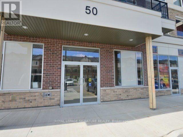 The image shows the front of a building with the number 50 on it.