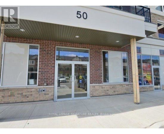 The image shows the front of a building with the number 50 on it.