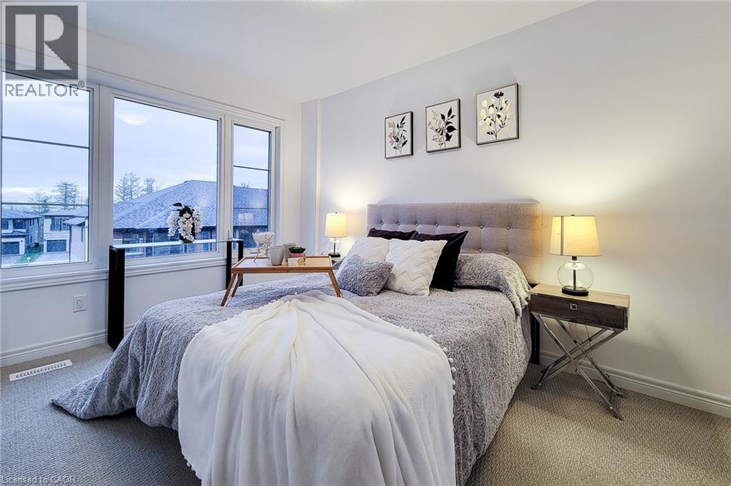 A bedroom with a large bed and a view of the outside.
