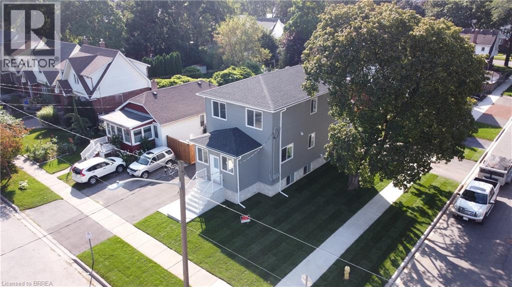 A realtor image of a house with a car parked in front.