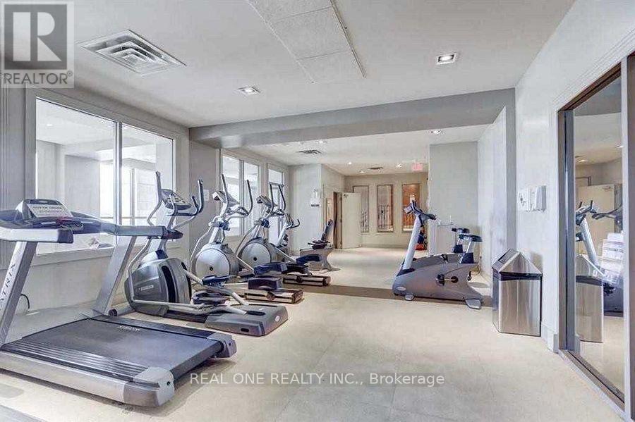 A gym with treadmills, elliptical machines, and other exercise equipment.