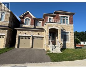 A two-story house with a garage is for sale.