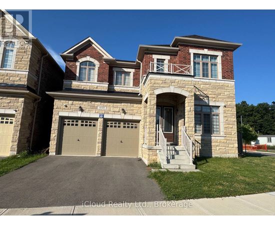 A two-story house with a garage is for sale.