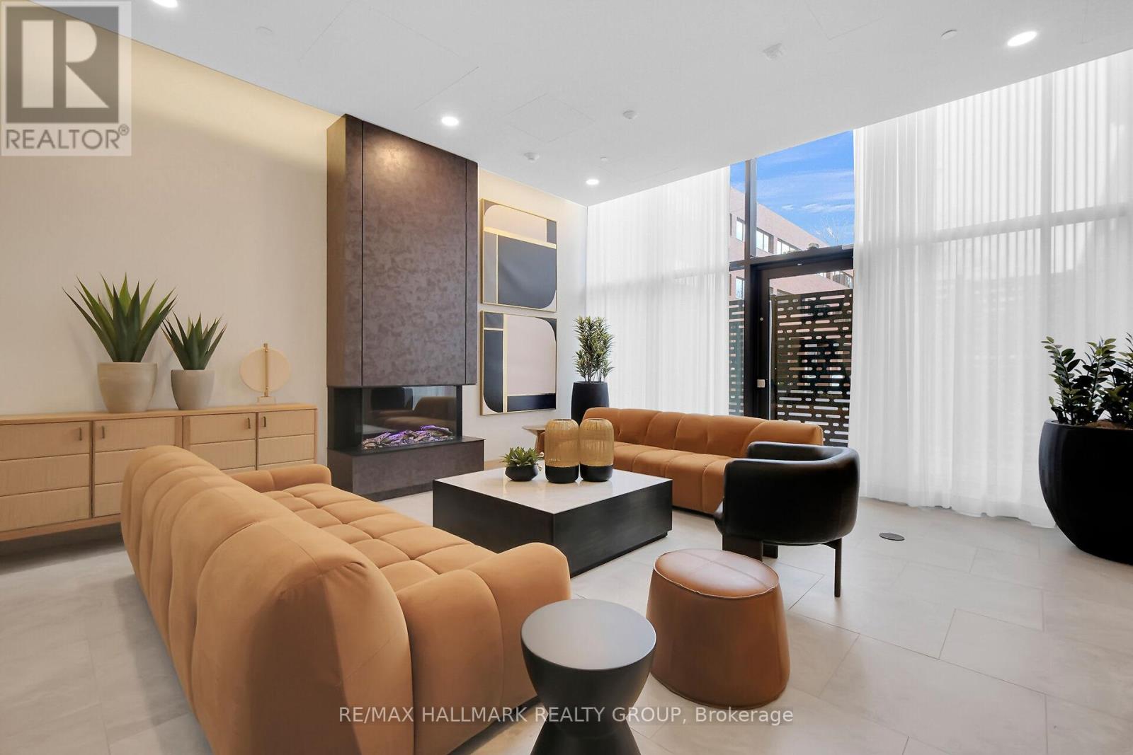 A living room with a long sofa and a coffee table.
