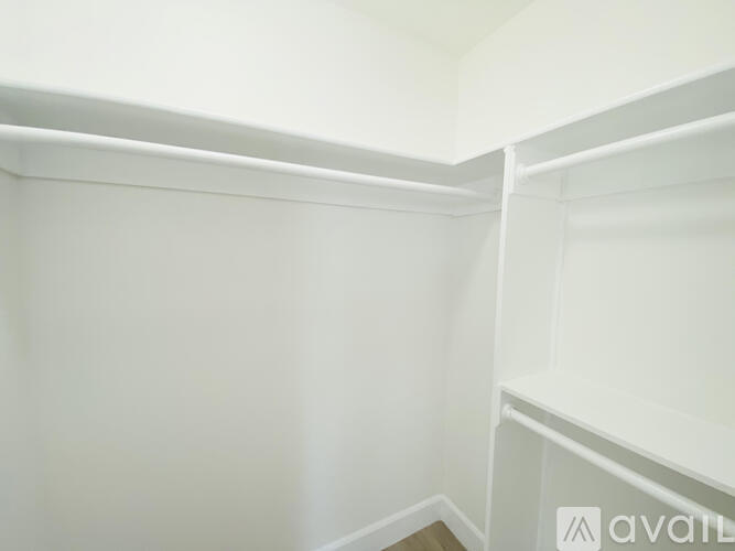 A white refrigerator with a white background.