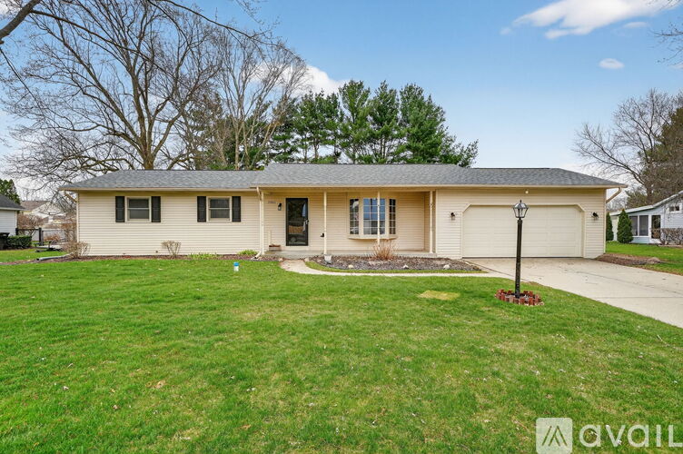 A house with a lawn in front of it is for sale.