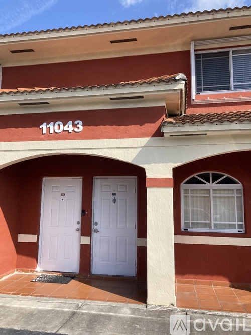 A red building with the number 11043 on the top.