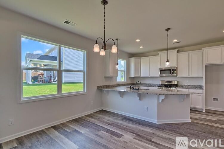 A kitchen with a large island in the middle of the room.