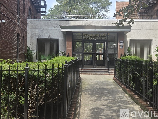 The image shows a building entrance with a sign that reads "ZZ CORKA".