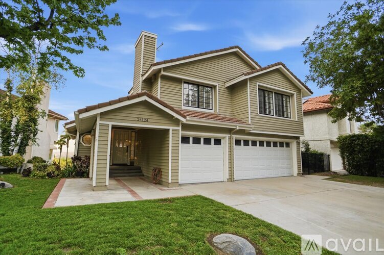 A house with a garage is for sale.