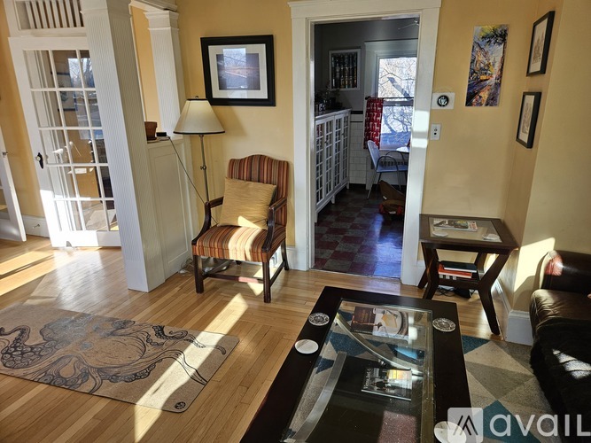 A living room with a chair and a table.