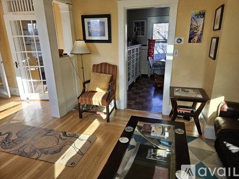 A living room with a chair and a table.