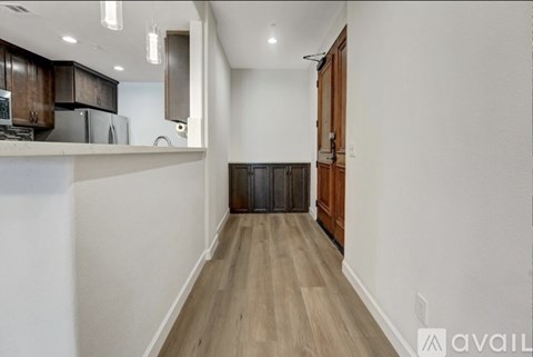 A kitchen with wooden cabinets and a white countertop.