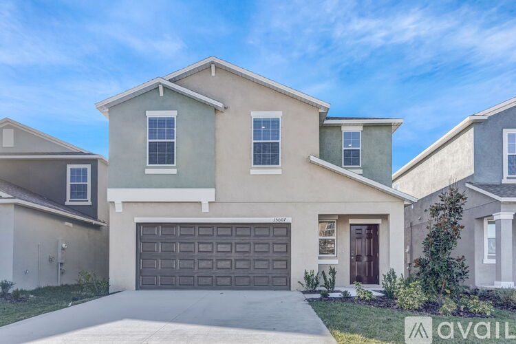 A house with a garage is for sale.
