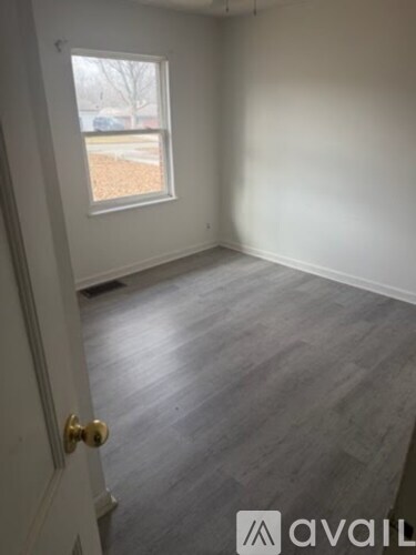 A room with a door and a window.