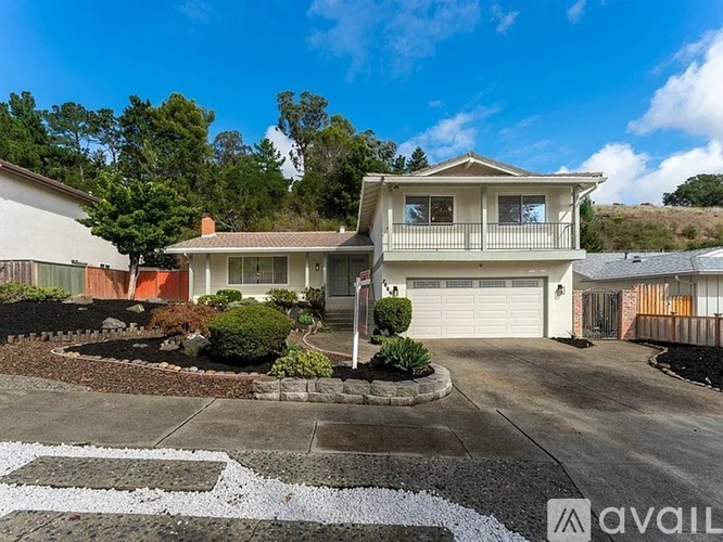 A house with a driveway in front of it.