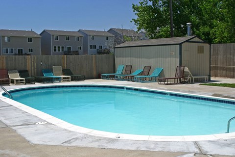A small pool with a white border and blue water.