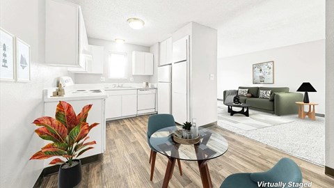 A modern kitchen with a dining table and chairs.