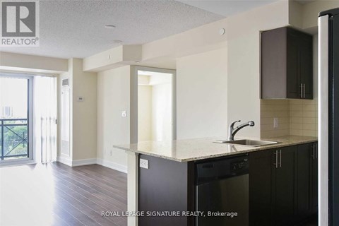 A kitchen with a sink and a dishwasher.
