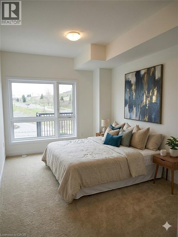 A bedroom with a large bed and a painting on the wall.