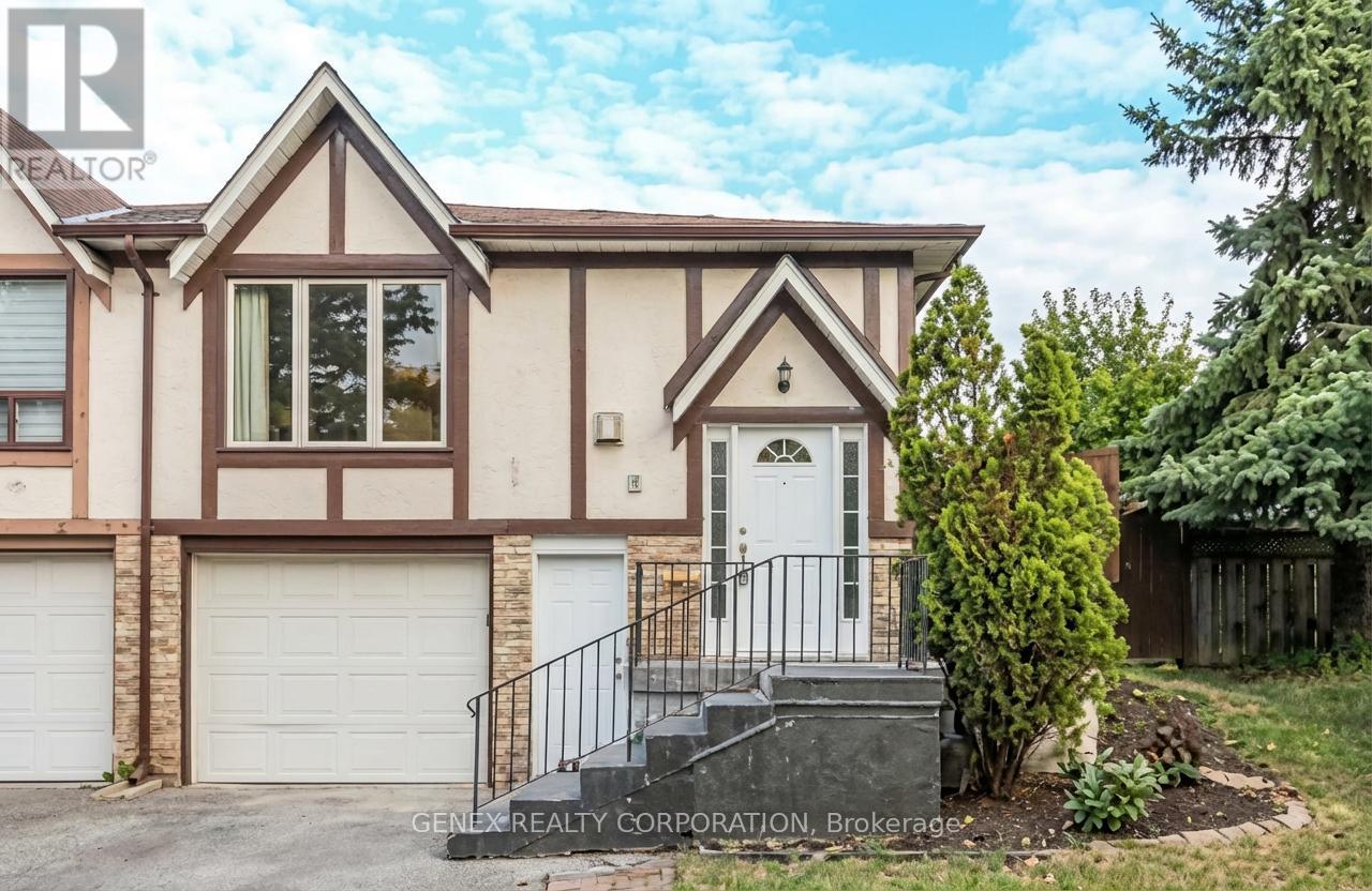 A house with a white door and a garage door is for sale.