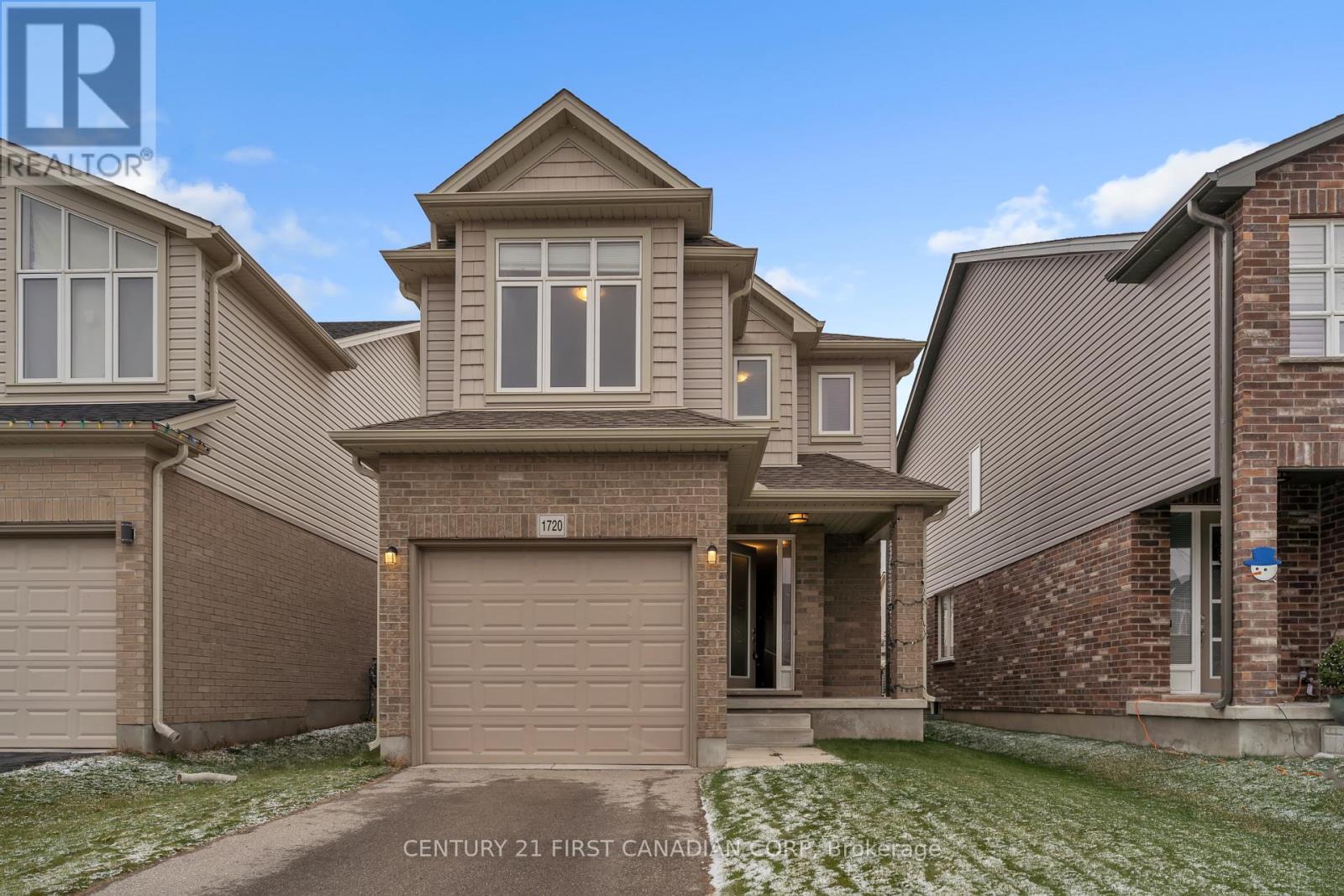 A house with a garage is located in a residential area.