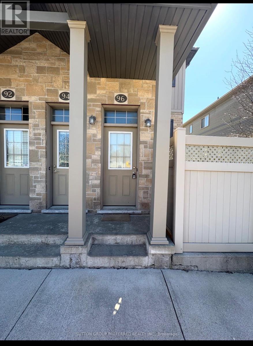 The image shows the front of a house with the number 94 on the door.