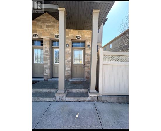 The image shows the front of a house with the number 94 on the door.
